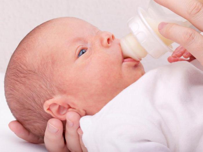 why does the baby spit up milk after feeding?