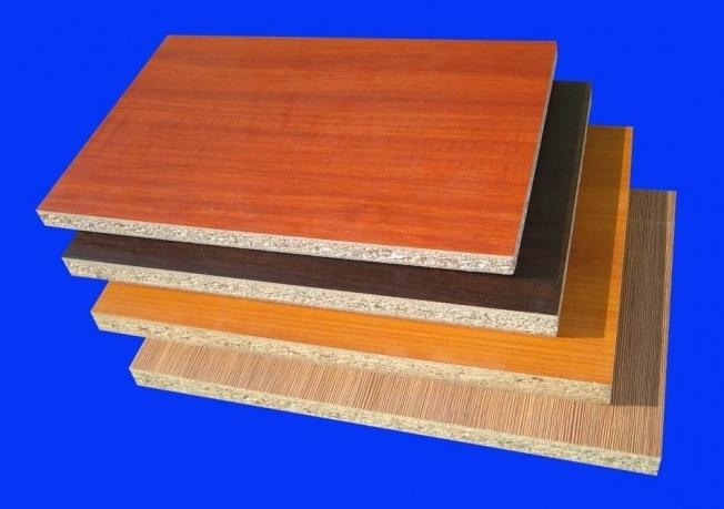 What are the dimensions of a sheet of particleboard, and why is it so important to know these parameters