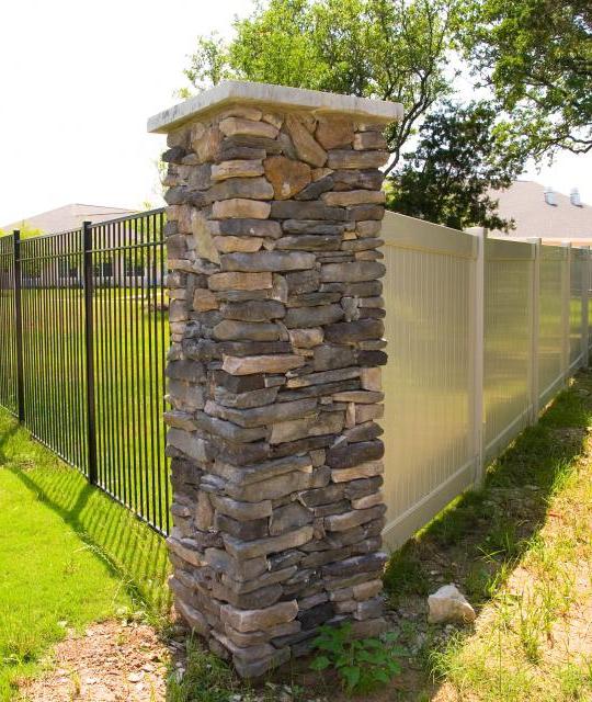 What is the function of the brick fence posts?