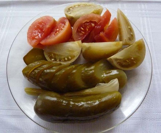 Tomatoes and pickled cucumbers - homemade culinary masterpieces