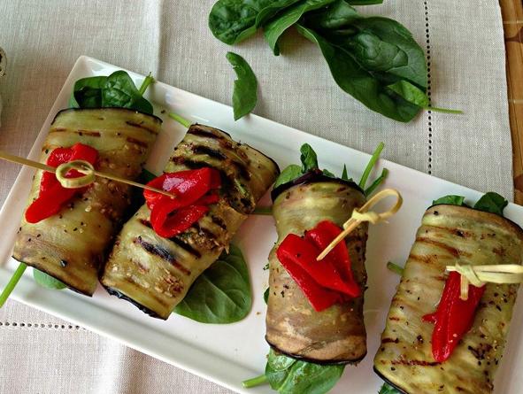 Eggplant rolls with cheese and tomatoes - delicious appetizer for a festive table