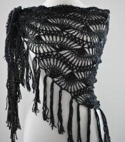 Openwork scarf crocheted on the fork